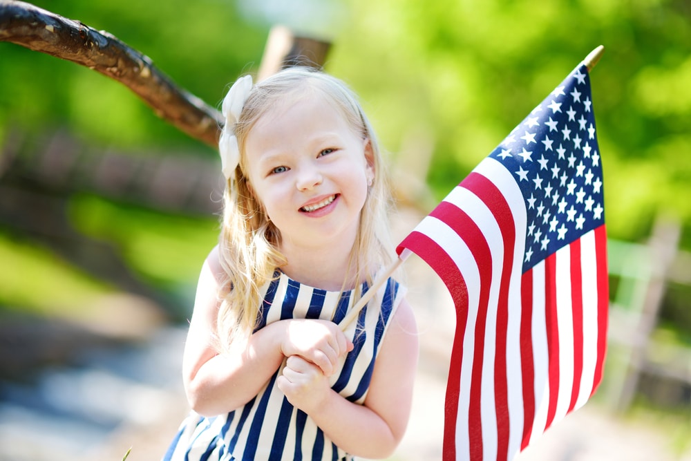 Little girl holding American flag