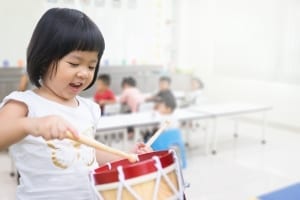 Little kid playing drum